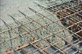 Steel reinforcement bars (rebar) arranged in a grid pattern within con