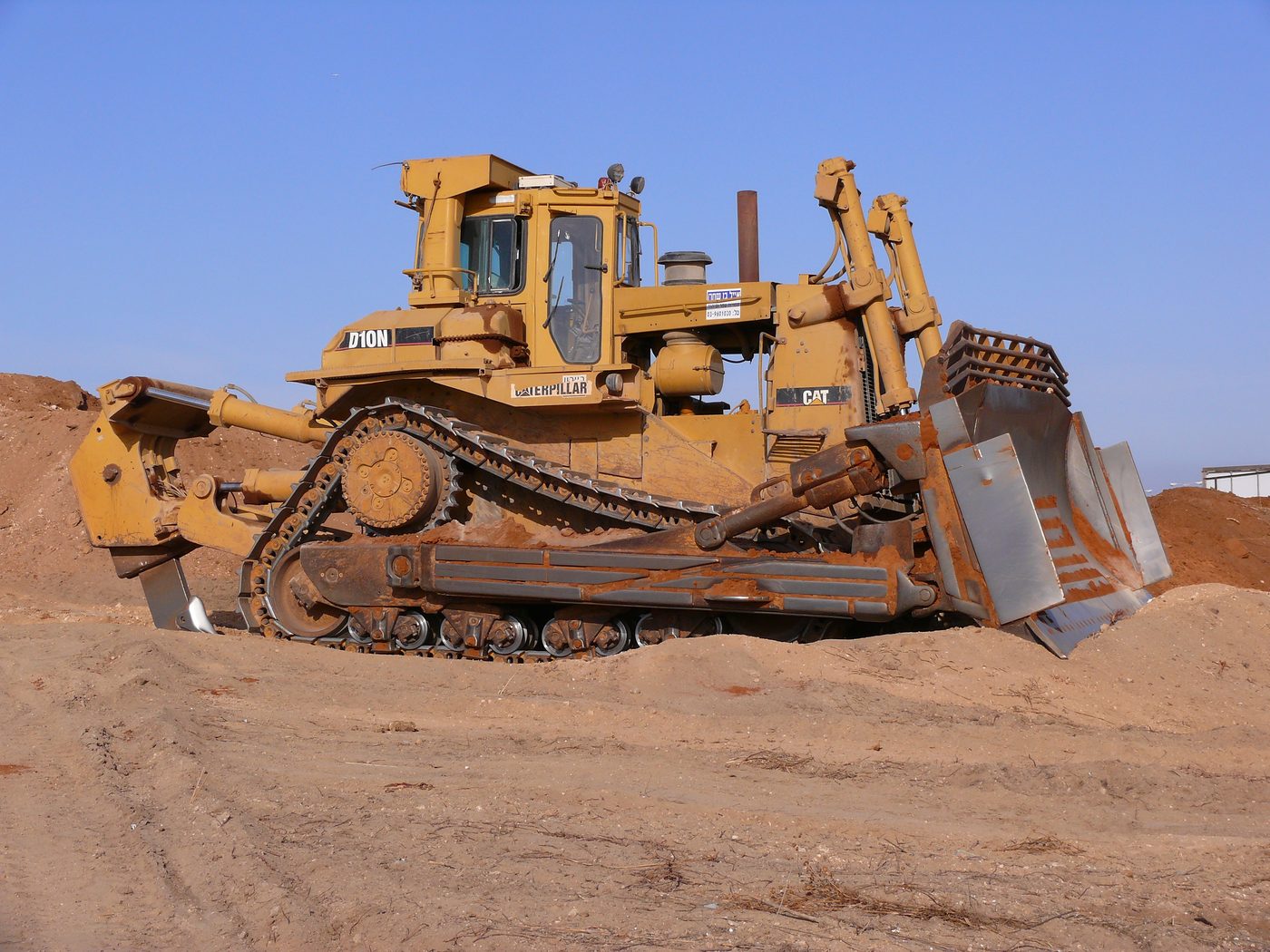 Yellow bulldozer on construction site