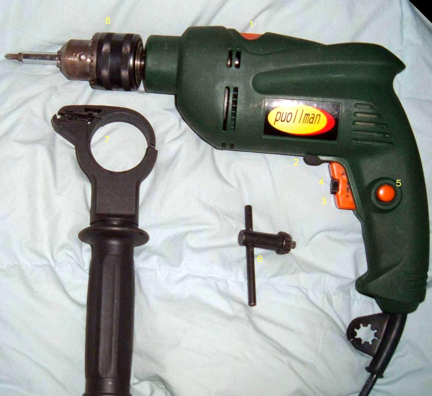 Electric drill with handle and chuck key