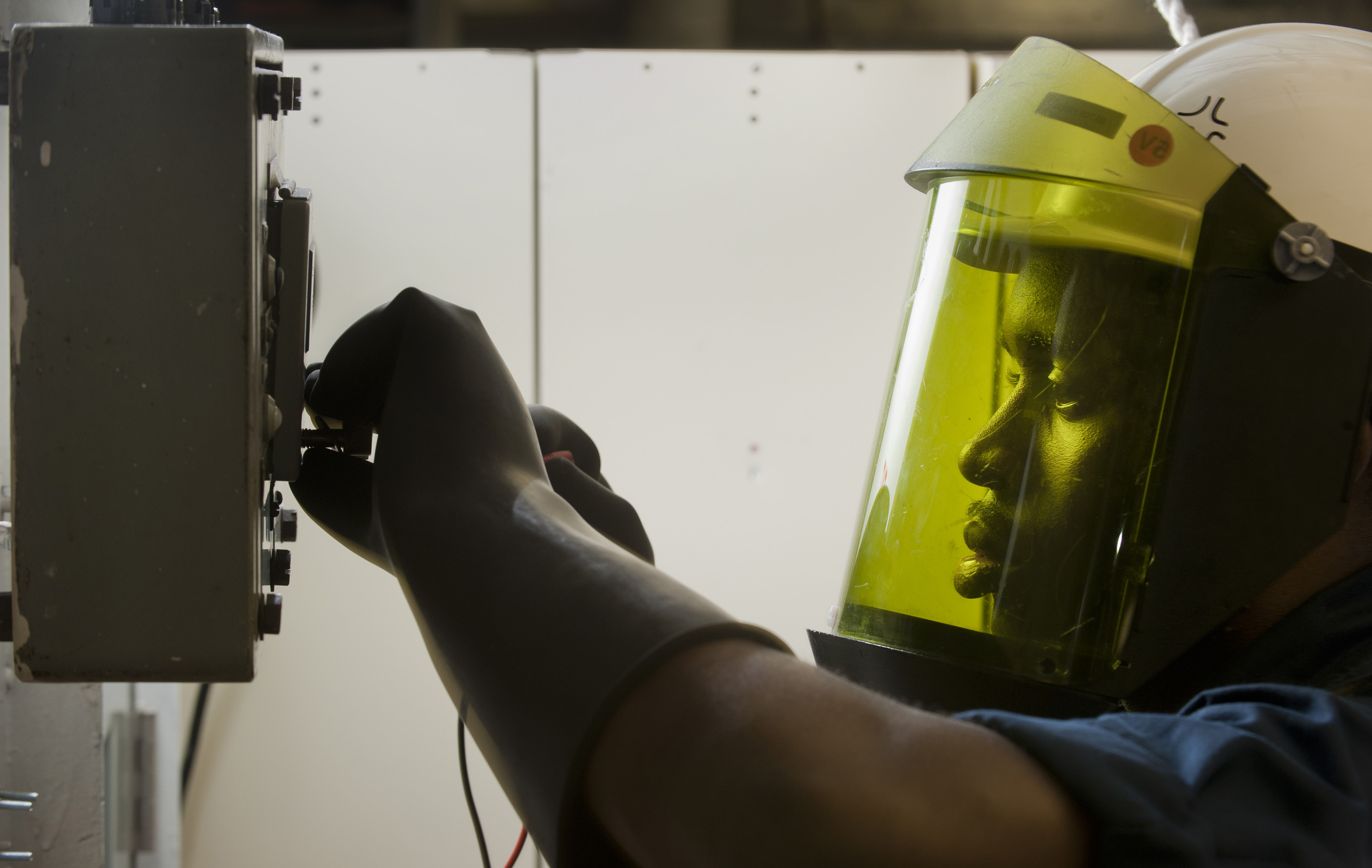 Person wearing a yellow face shield