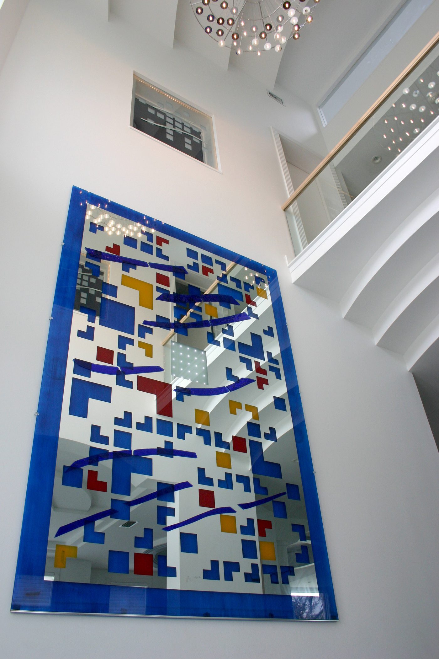 Laminated glass art panel in building interior