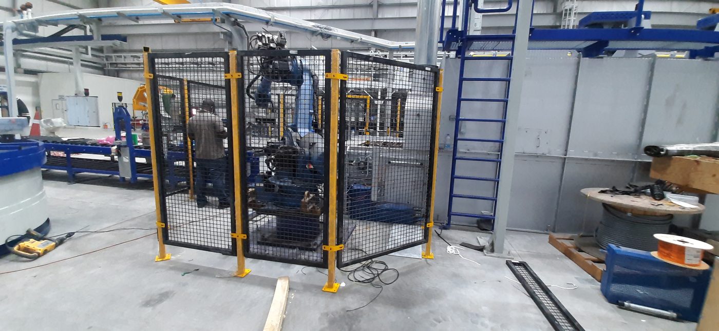 Industrial machine guard enclosing equipment