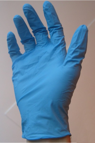 Blue nitrile glove on a hand