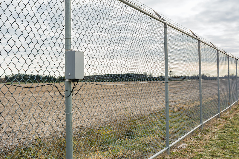 Perimeter fencing with electrical enclosure