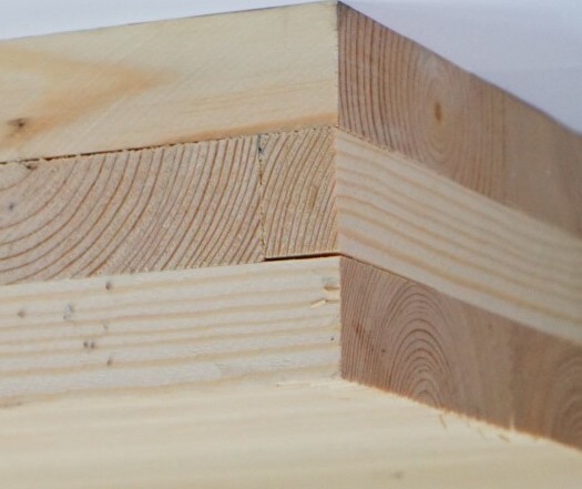 stacked pieces of solid timber wood