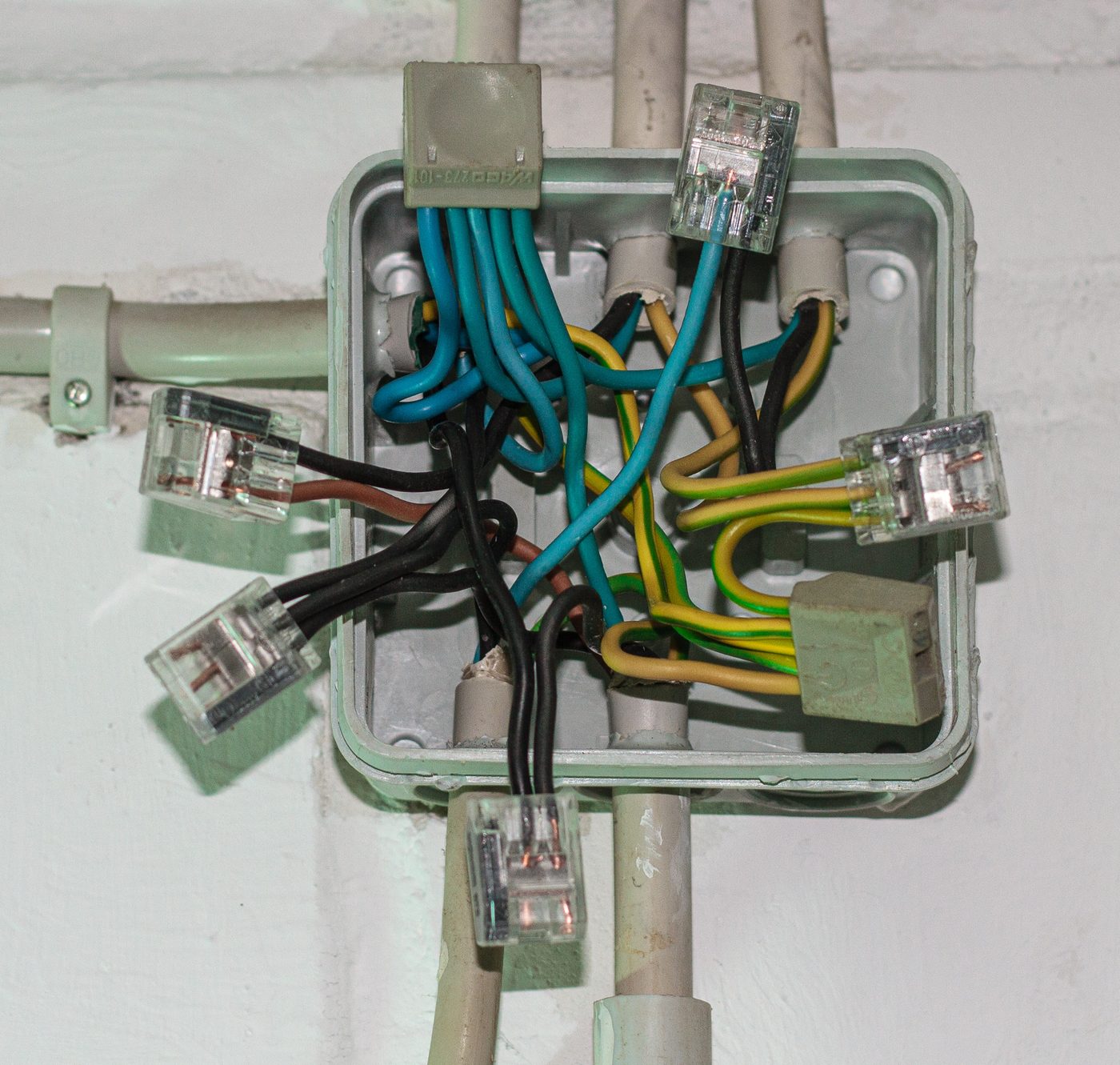 Surface-mounted electrical junction box with wiring