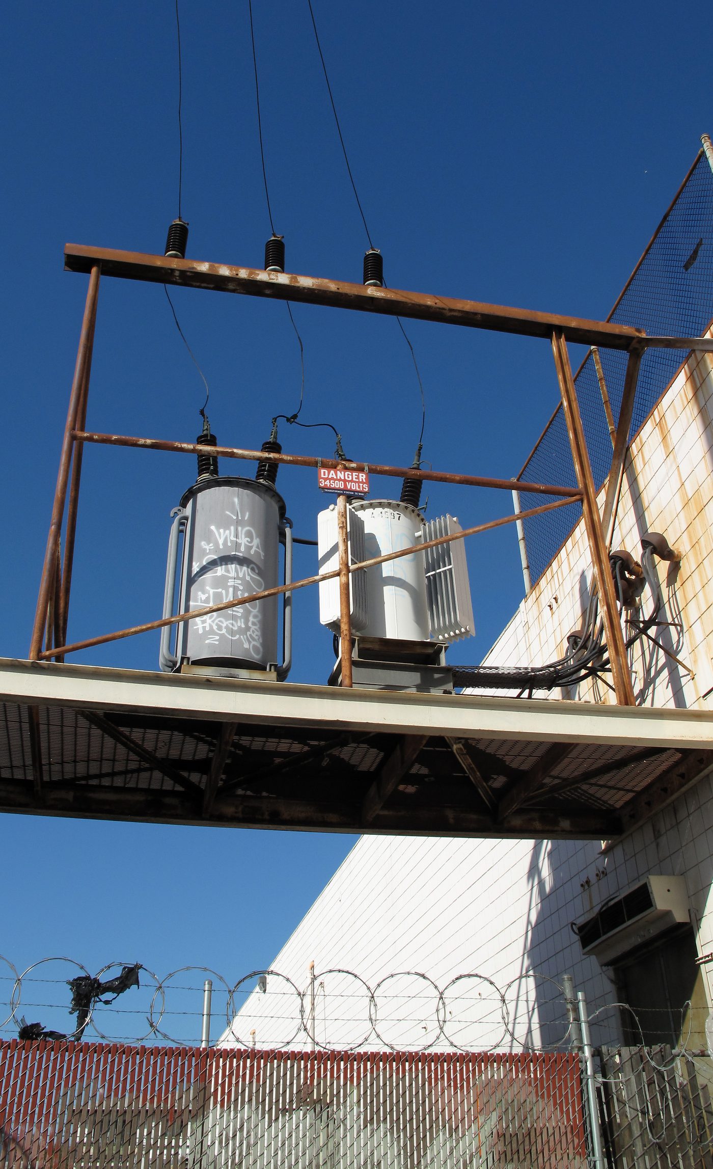 Outdoor electrical transformers on a pole