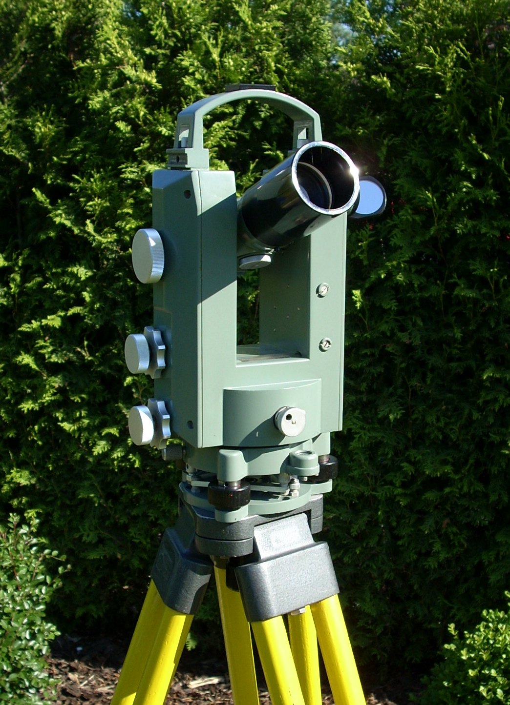 Transit theodolite on tripod outdoors