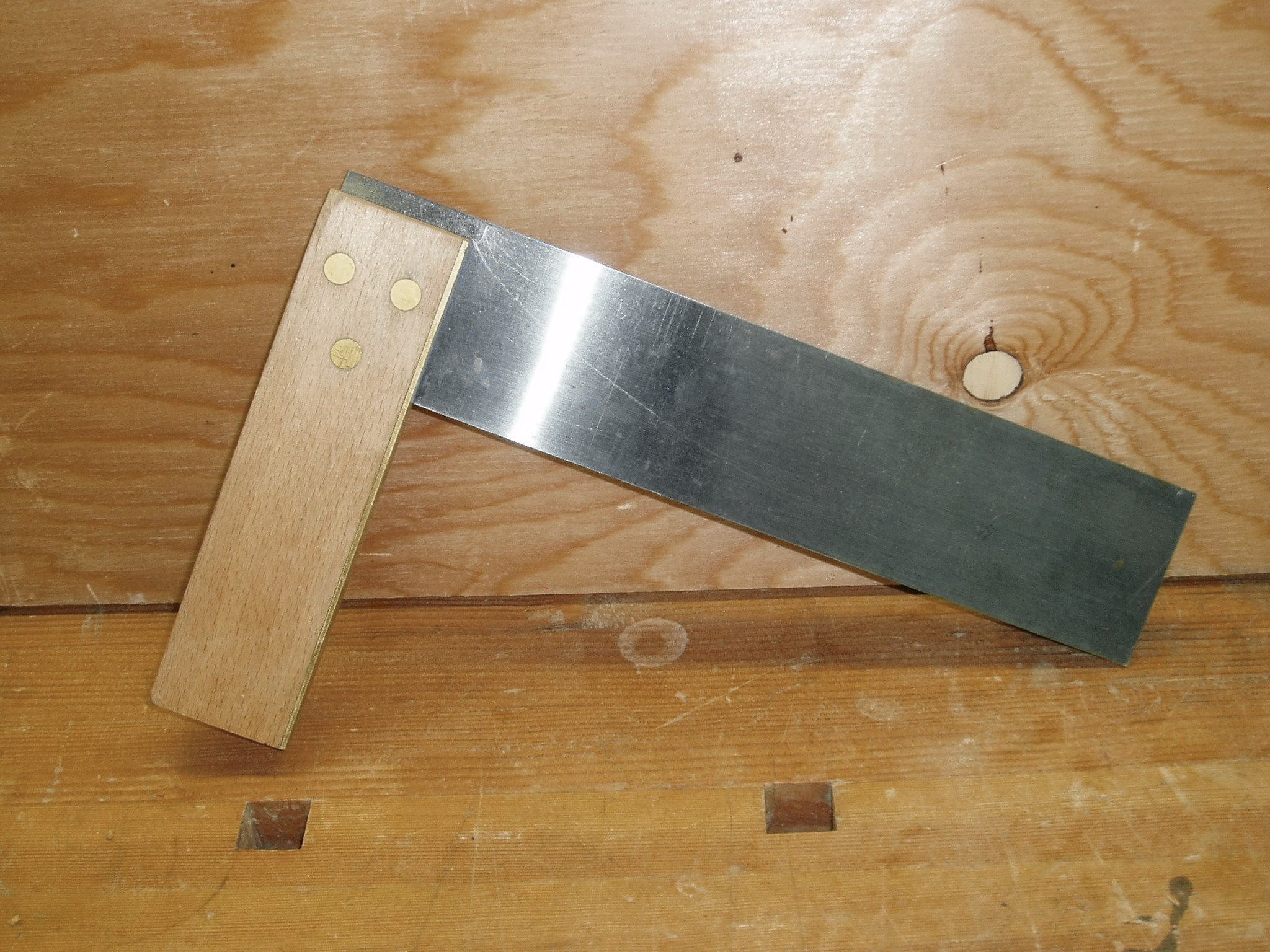 A try square on a wooden surface